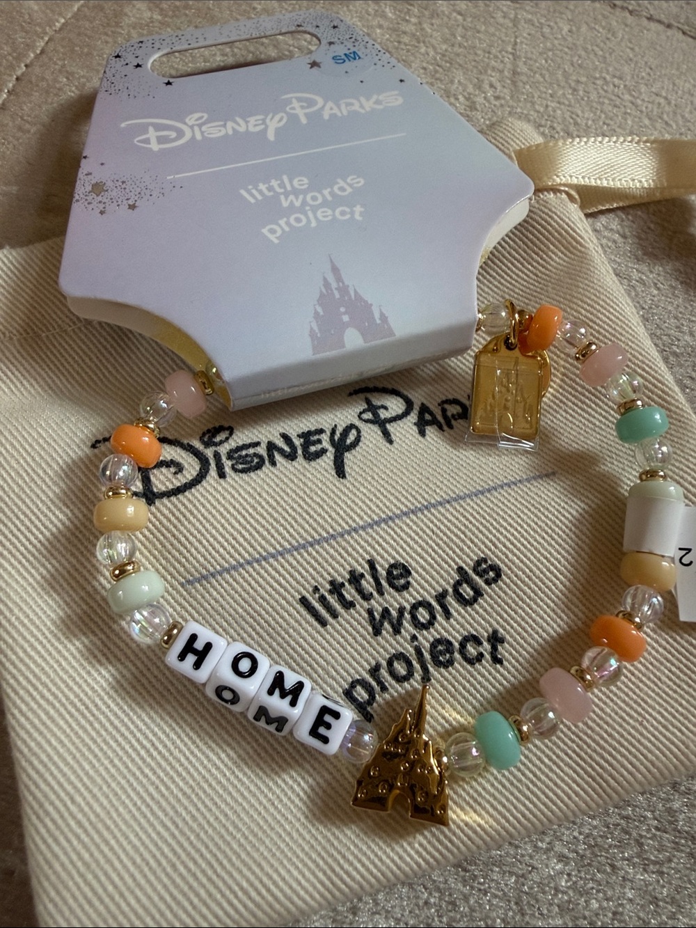 Disney pastel multicolor 'HOME' beaded bracelet with gold castle charm